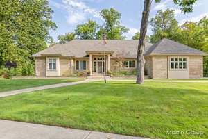 Embrace Modern Luxury and Timeless Craftsmanship in this Meticulously Maintained East Grand Rapids Masterpiece!