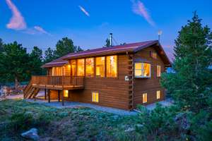 Log Home Perched on the Ridge with Sweet Divide Views