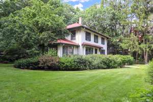 Auburndale NEWTON: A classic home with exceptional perennial gardens, on a beautiful gaslit side street.