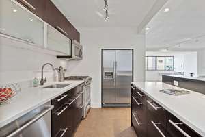 Stylish & sparkling high floor 2 bed, 2 bath move in ready condo in concierge building. Largest Layout, 1317 sf!