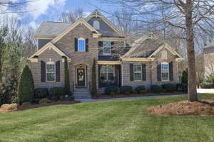 Stunning custom home on 3/4th of an acre located in desirable Legacy at Jordan Lake