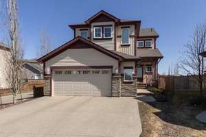 Exquisite custom-built home located in the desirable Walker