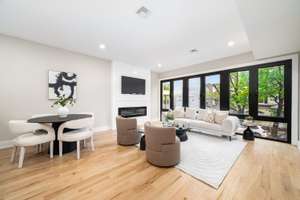 This pristine 3 bedroom condo with a private yard AND garage in Jersey City Heights is waiting for you!