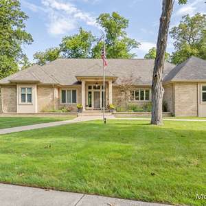 Embrace Modern Luxury and Timeless Craftsmanship in this Meticulously Maintained East Grand Rapids Masterpiece!