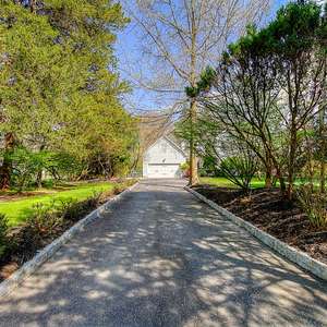 Tranquility abounds in this Shore Colonial in Wall. Spend your summer relaxing in the backyard featuring a deck, patio, natural woods & a gentle creek.
