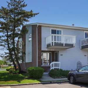 Waterfront, end unit, two bedroom, 2.5 baths, updated, 2 level townhouse in beautiful Monmouth Beach.