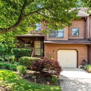 Exceptional location: end unit backing up to quiet woodlands.