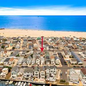 Prime Point Pleasant Beach Real Estate Location, Check out this Legal, rare two family GEM, Airbnb Haven,& investors opportunity located within a short block from the beach.