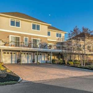 Let the sunlight in! Just steps to the river and ocean, this spectacular contemporary home spared no expense!