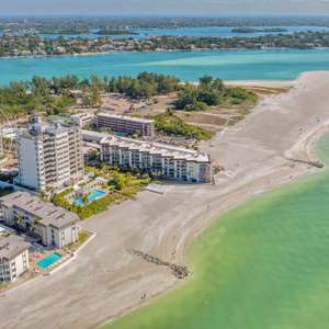 Indulge in the epitome of coastal elegance with this extraordinary residence at Orchid Beach Club.