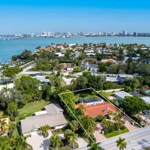 Welcome to your future oasis on the prestigious Bird Key!