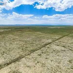Rural 40.46 acre level parcel with sweeping views located in Avonsdale, CO.