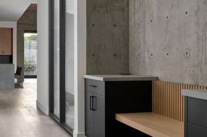 18 of 27. Concrete walls meet sleek cabinetry in this designer drop zone combining style and utility to keep life organized and flowing with ease from indoors to out.