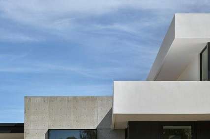 24 of 27. A vertical angle captures the strong architectural lines and bold material palette white stucco, dark accents, and exposed concrete define this custom Arcadia home s modern identity.