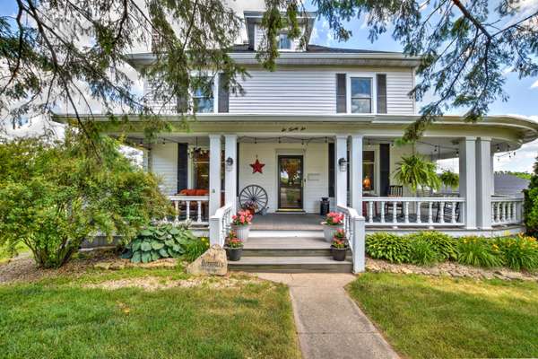 Century Foursquare Farmhouse on 3.89 acres promises quiet rural living at the edge of town