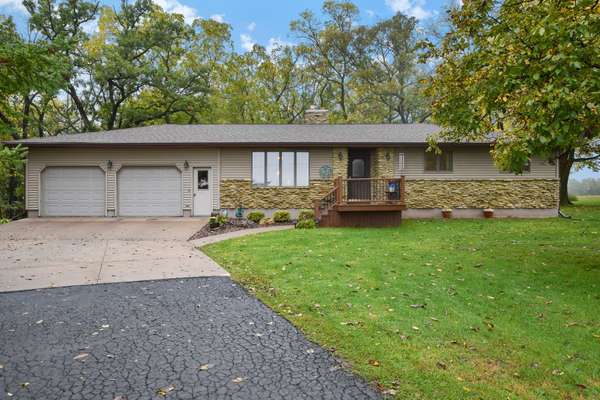 Move-in ready ranch on 5+ forested acres!