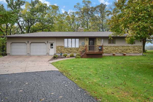 Move-in ready ranch on 5+ forested acres!