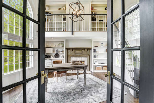 FRENCH DOORS OPEN TO LIBRARY FROM LIVING RM