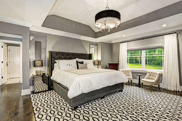 LAVISH AND LUXURIOUS MASTER SUITE, FEATURES 2 WALK-IN CLOSETS AND A TRAY CEILING