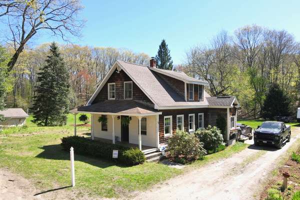 Charming Farmhouse Cape on 1.2 Acres with Privacy & Green Space