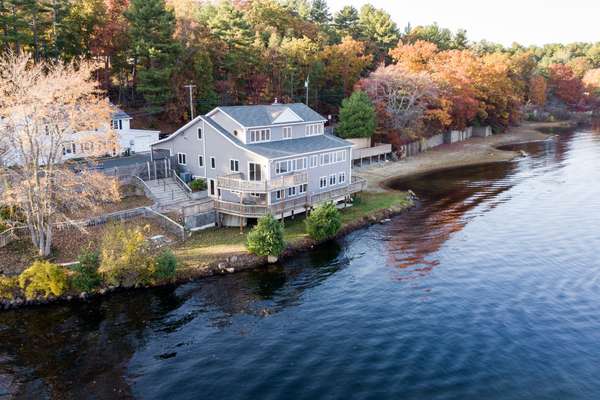 ULTIMATE YEAR-ROUND LIVING ON CRYSTAL LAKE - OVER 1,500FT OF FRONTAGE + PRIVATE BEACH!