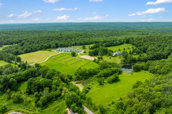 PROMINENT 55-ACRE EQUESTRIAN FACILITY WITH PRIMARY RESIDENCE & 2 APARTMENTS