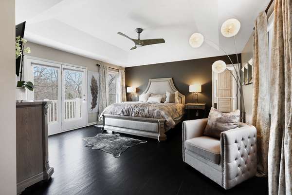 Spacious master retreat with a deep coffered ceiling.