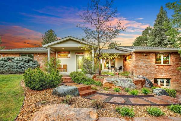 You will enjoy the peace and tranquility of living in this beautiful contemporary remodel with majestic trees and back range views high on the hill in Niwot.