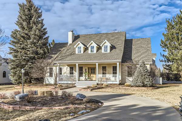 This charming farm-style home in Niwot offers a serene retreat with wide plank floors, a main level ensuite, an open kitchen, a loft flex area, and a guest suite above the garage.