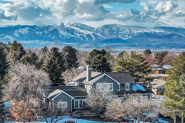 Welcome to this exceptional custom home in Niwot, offering privacy, natural beauty, and luxurious living in a serene setting with breathtaking views of open space and city lights.