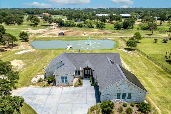 CUSTOM HOME WITH LARGE POND ON 2 ACRES