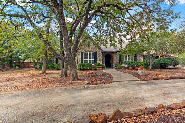 Attractive Home on 1.5-Acres in a Private Wooded Setting with a Prime Location