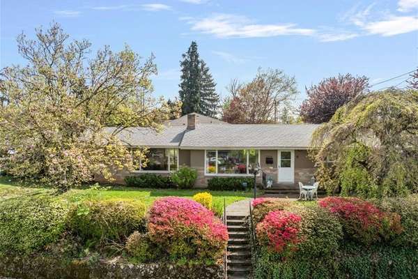 Discover Timeless Elegance: 1957 Ranch Home with Basement on .24 Acres