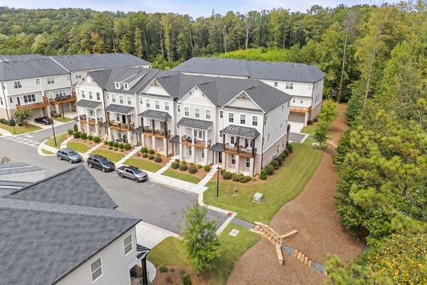 Stunning, elevator-ready, end-unit townhome, built in 2020, located in the highly desirable Riverwalk community in Roswell!