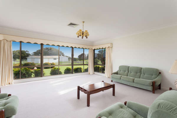 The formal living room with lovely rural views and beautiful sunsets