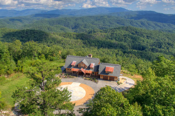 What a setting! What a backyard view! Enjoy the Great Smoky Mountains all the time from this luxury mountain home.
