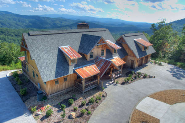 The majestic peaks of the Great Smoky Mountains National Park create a breathtaking backdrop for this luxury mountain home.