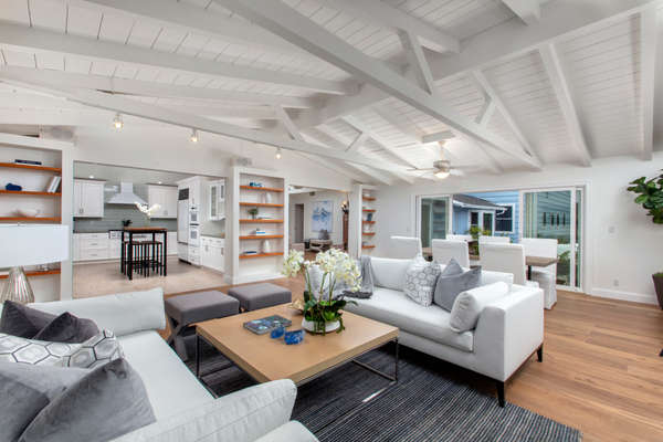 Open concept living room with high beam ceilings